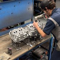 ASE-certified technician working on Subaru engine at M45 Automotive in Auburn, CA